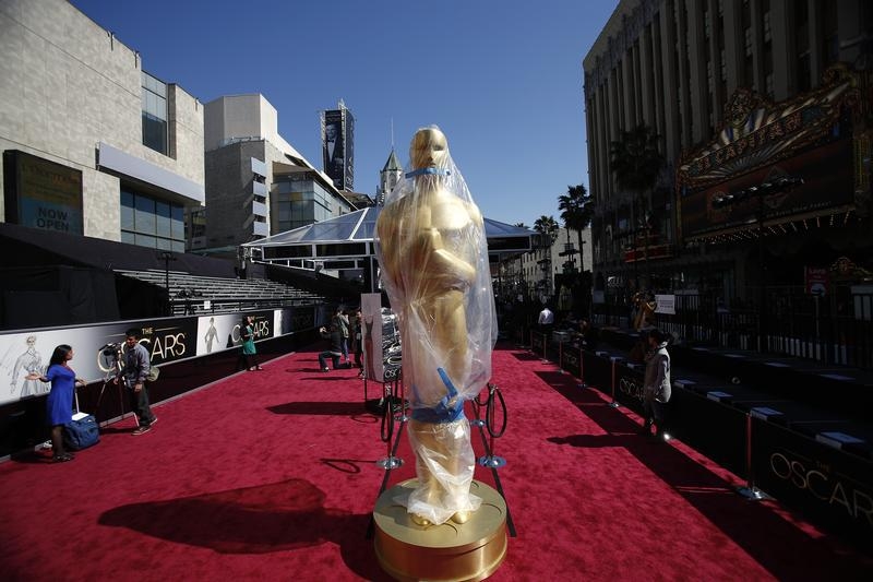 An Oscar statue on the red carpet is covered with a plastic tarp during preparations for the 85th Academy Awards in Hollywood