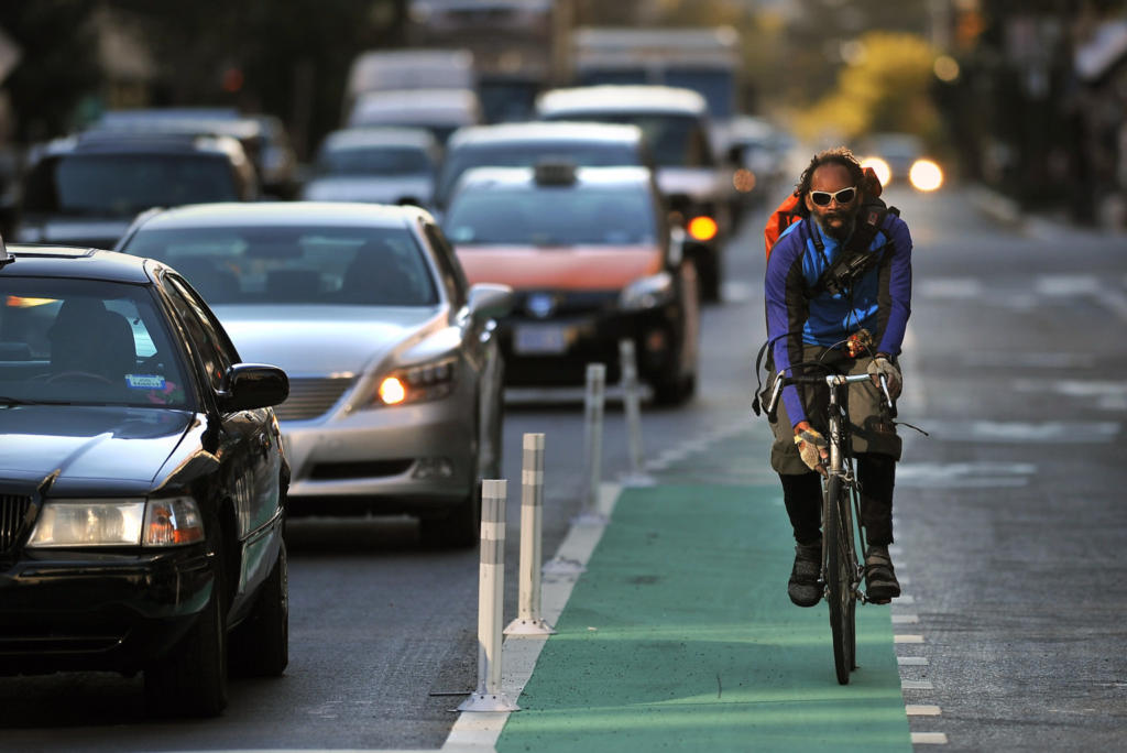Bicyclists using bike lane along L St. NW - Washington, DC