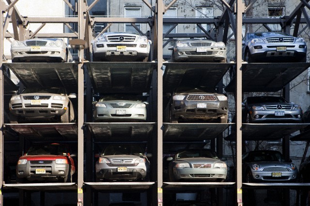 Cars in a Parking Lift, Manhattan, New York City, NY, USA --- Image by © Caspar Benson/fstop/Corbis
