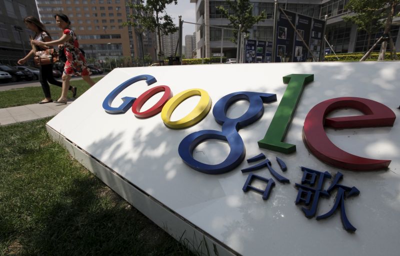 Women walk past the Google logo in front of its former headquarters in Beijing in this June 2, 2011 file photo. Google Inc CEO Sundar Pichai has made no secret that he wants to get back into China via Google Play, the app store for its Android mobile operating system. But it's unlikely to be a smooth ride. Google largely pulled its services out of China five years ago after refusing to continue self-censoring its search results. Since then, it has maintained a limited presence in the world's biggest Internet market, but most of its services, including Play, have been rendered borderline inaccessible. REUTERS/Jason Lee/Files