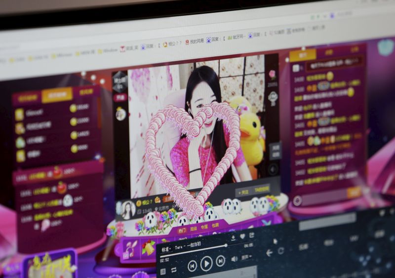 A digital gift is seen on the screen, which was bought and presented by a fan, as online hostess Xianggong gives a live broadcast in Beijing, February 10, 2015. In China's online hostessing world, men find virtual company and the women can find riches. Xianggong is one of more than 10,000 hostesses on the internet site bobo.com, a live broadcasting web platform where anyone can record themselves singing, playing piano, dancing or just chatting. REUTERS/Jason Lee  PICTURE 3 OF 27 FOR WIDER IMAGE STORY ‘CHINA’S ONLINE HOSTESSES’ SEARCH 'XIANGGONG’ FOR ALL IMAGES