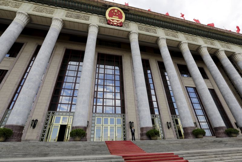 An officer stands outside the Great Hall of the People, the venue of  National People's Congress, China's parliament, in Beijing, June 18, 2015. China's legislature adopted a national security law on Wednesday that will enable authorities to "take all necessary" measures to safeguard territorial sovereignty and ensure full control over the country's Internet infrastructure. Picture taken June 18, 2015. REUTERS/Jason Lee