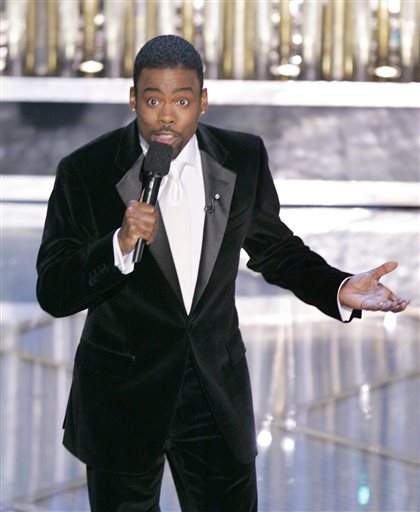 FILE - In this Feb. 27, 2005 file photo, Chris Rock hosts the 77th Academy Awards telecast in Los Angeles. Rock will return to host the Oscars for a second time. The shows producers say the prolific comedian-filmmaker will be at the helm for the 88th Academy Awards next February 28. (AP Photo/Mark J. Terrill)