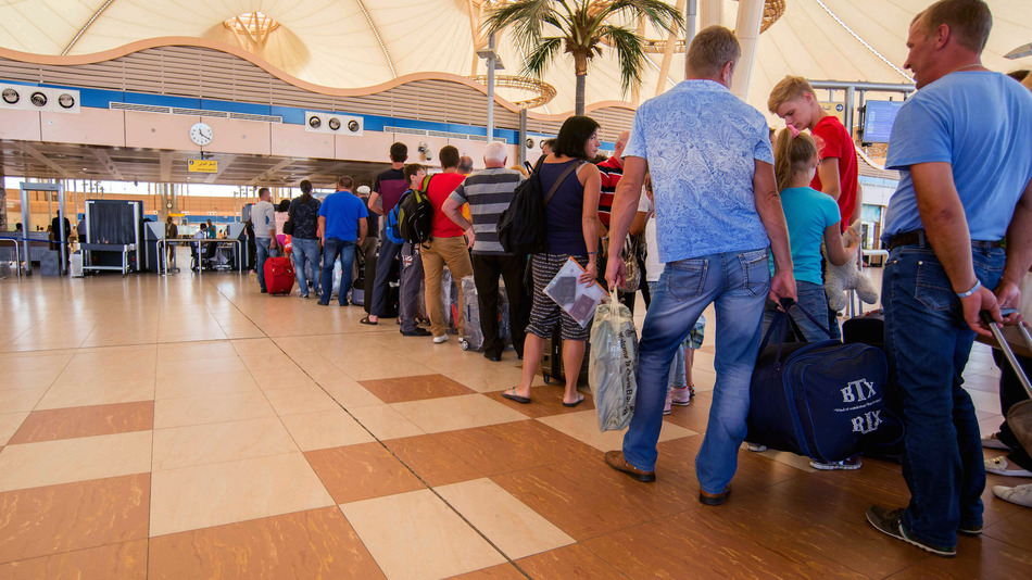 Passengers line up to depart from Sharm el-Sheikh Airport hours after a Russian aircraft carrying 224 people, including 17 children, crashed about 20 minutes after taking off from Sharm el-Sheikh, a Red Sea resort popular with Russian tourists, in south Sinai, Egypt, Saturday, Oct. 31, 2015. A Russian Metrojet plane crashed Saturday morning in a mountainous region in the Sinai after taking off from Sharm el-Sheikh, killing all 224 people aboard. A senior aviation official said the pilot had radioed that the aircraft was experiencing technical problems shortly before air traffic controllers lost contact with the plane. (AP Photo)