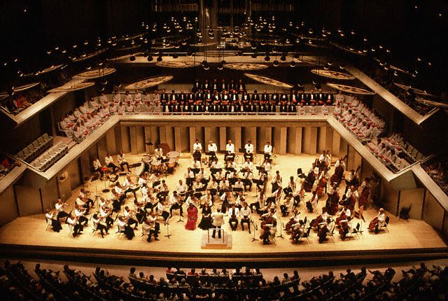 ca. August 1983, Toronto, Ontario, Canada --- The Toronto Symphony performs with a chorus at the Roy Thompson Hall in Toronto, Canada. | Location: Roy Thompson Hall, Toronto, Ontario, Canada. --- Image by © Kelly-Mooney Photography/Corbis