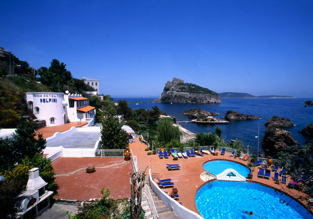 20 Jul 1998, Ischia, Italy --- Visitors to the Hotel Delfini get a view of the Castello Aragonese. The castle sits on a 300 foot high rocky crag and is accessible by a stone causeway. --- Image by © Atlantide Phototravel/Corbis