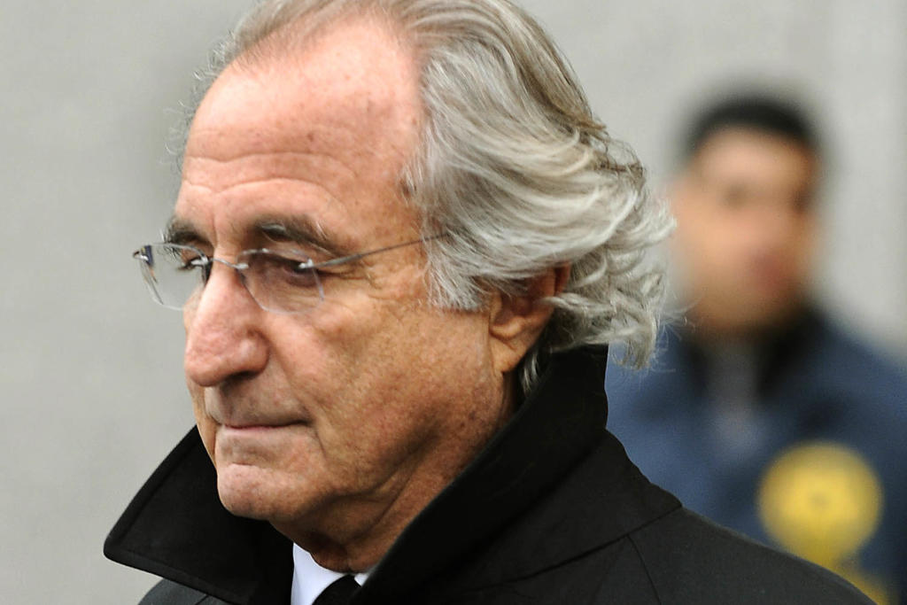 (FILES)Bernard Madoff leaves US Federal Court in this January 14, 2009 file photo after a hearing regarding his bail in New York. A year after Bernard Madoff's arrest in Wall Street's biggest fraud, only three people have admitted guilt, few victims have been compensated and billions of dollars remain missing. It was 12 months ago December 10, 2008 that Madoff -- until then believed to be one of New York's most successful money managers -- was arrested for running a Ponzi scheme of epic proportions.To the horror of thousands of investors, including major banks, Hollywood moguls and savvy financial players, Madoff admitted that for decades he had not been investing their money at all.AFP PHOTO / TIMOTHY A. CLARY (Photo credit should read TIMOTHY A. CLARY/AFP/Getty Images)