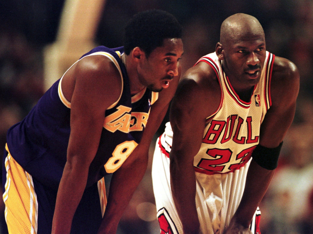 CHICAGO, UNITED STATES: Los Angeles Lakers guard Kobe Bryant(L) and Chicago Bulls guard Michael Jordan(R) talk during a free-throw attempt during the fourth quarter 17 December at the United Center in Chicago. Bryant, who is 19 and bypassed college basketball to play in the NBA, scored a team-high 33 points off the bench, and Jordan scored a team-high 36 points. The Bulls defeated the Lakers 104-83. AFP PHOTO VINCENT LAFORET (Photo credit should read VINCENT LAFORET/AFP/Getty Images)