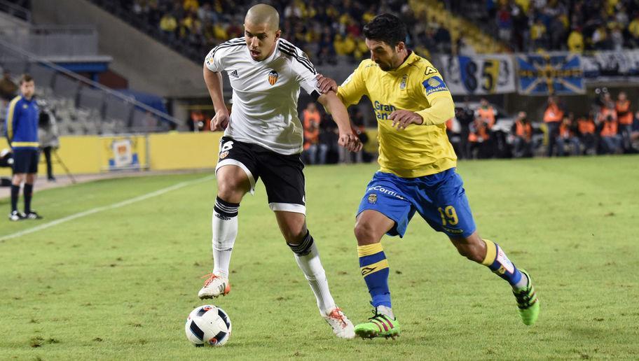 Valencia's French midfielder Sofiane Feghouli (L) vies with Las Palmas' Argentinian midfielder Emmanuel Culio during the Spanish Copa del Rey (King's Cup) football match UD Las Palmas vs Valencia CF at the Estadio de Gran Canaria in Las Palmas de Gran Canaria on January 28, 2016.  AFP PHOTO / DESIREE MARTIN / AFP / DESIREE MARTIN        (Photo credit should read DESIREE MARTIN/AFP/Getty Images)