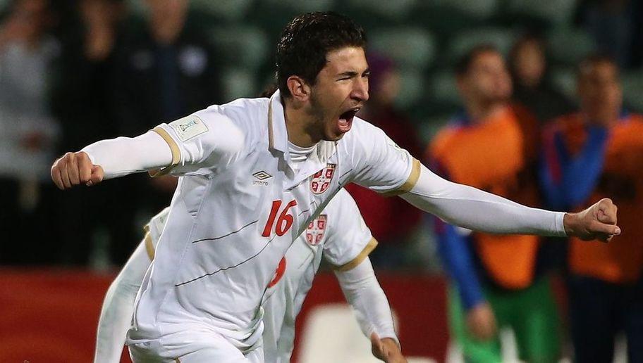 Marko Grujic of Serbia (R) leads teammates as they celebrate their victory during a penalty shootout during the FIFA U20 World Cup quarter-final match between the USA and Serbia in Auckland on June 14, 2015. AFP PHOTO / Fiona GOODALL (Photo credit should read Fiona GOODALL/AFP/Getty Images)