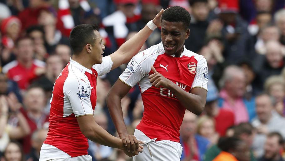 Arsenal's Nigerian striker Alex Iwobi (R) celebrates with Arsenal's Chilean striker Alexis Sanchez after scoring during the English Premier League football match between Arsenal and Watford at the Emirates Stadium in London on April 2, 2016.  / AFP / Ian Kington / RESTRICTED TO EDITORIAL USE. No use with unauthorized audio, video, data, fixture lists, club/league logos or 'live' services. Online in-match use limited to 75 images, no video emulation. No use in betting, games or single club/league/player publications.  /         (Photo credit should read IAN KINGTON/AFP/Getty Images)