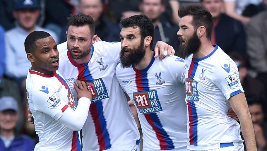 Crystal Palace's Irish defender Damien Delaney (2nd L) celebrates with Crystal Palace's English midfielder Jason Puncheon (L), Crystal Palace's Australian midfielder Mile Jedinak (2nd R) and Crystal Palace's Welsh midfielder Joe Ledley (R) after scoring the opening goal during the English Premier League football match between West Ham United and Crystal Palace at The Boleyn Ground in Upton Park, in east London on April 2, 2016. / AFP / OLLY GREENWOOD / RESTRICTED TO EDITORIAL USE. No use with unauthorized audio, video, data, fixture lists, club/league logos or 'live' services. Online in-match use limited to 75 images, no video emulation. No use in betting, games or single club/league/player publications.  /         (Photo credit should read OLLY GREENWOOD/AFP/Getty Images)