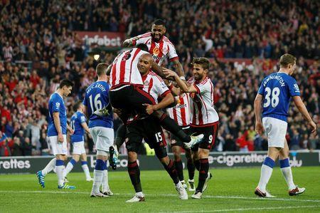 Britain Football Soccer - Sunderland v Everton - Barclays Premier League - The Stadium of Light - 11/5/16 Lamine Kone celebrates scoring the third goal for Sunderland with Younes Kaboul and team mates Action Images via Reuters / Jason Cairnduff