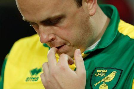 Britain Football Soccer - Norwich City v Watford - Barclays Premier League - Carrow Road - 11/5/16 Norwich fan looks dejected at the end of the match after being relegated from the Barclays Premier League Action Images via Reuters / John Sibley