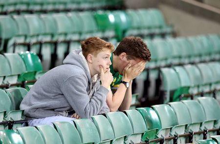 Britain Football Soccer - Norwich City v Watford - Barclays Premier League - Carrow Road - 11/5/16 Norwich fans looks dejected at the end of the match after being relegated from the Barclays Premier League Action Images via Reuters / Paul Childs