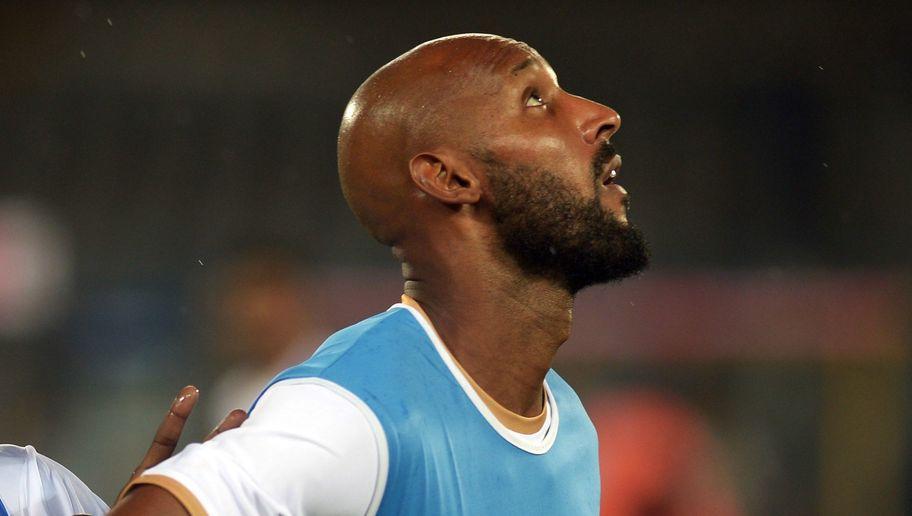 French footballer Nicolas Anelka participates in a training session with Mumbai City FC teammates in Kolkata on October 11, 2014. The Indian Super League (ISL) football is due to kick off September 12 in India's eastern city of Kolkata. AFP PHOTO/Dibyangshu SARKAR (Photo credit should read DIBYANGSHU SARKAR/AFP/Getty Images)