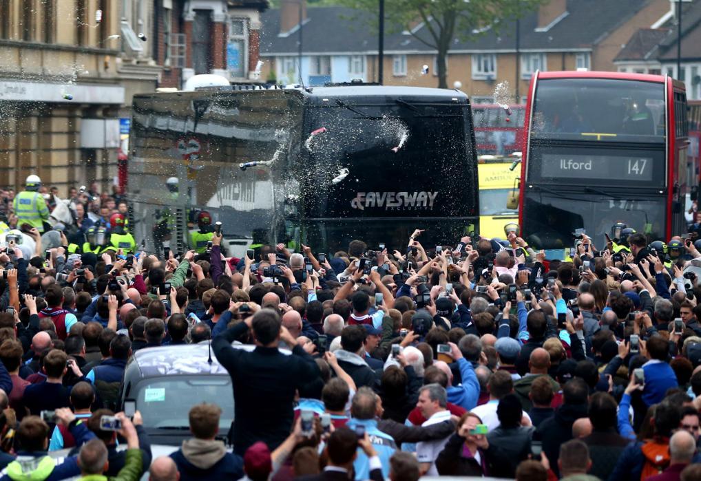 LONDON, ENGLAND - MAY 10: Bottles, beer and missiles are thrown at the Manchester United team bus as it tries to make it's way through the crowds that had congregated in the street prior to the Barclays Premier League match between West Ham United and Manchester United on May 10, 2016 in London, United Kingdom. (Photo by Catherine Ivill - AMA/Getty Images)