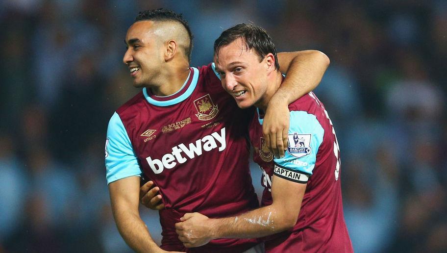 LONDON, ENGLAND - MAY 10: Mark Noble and Dimitri Payet of West Ham United of West Ham United celebrate victory after the Barclays Premier League match between West Ham United and Manchester United at the Boleyn Ground on May 10, 2016 in London, England. West Ham United are playing their last ever home match at the Boleyn Ground after their 112 year stay at the stadium. The Hammers will move to the Olympic Stadium for the 2016-17 season. (Photo by Paul Gilham/Getty Images)