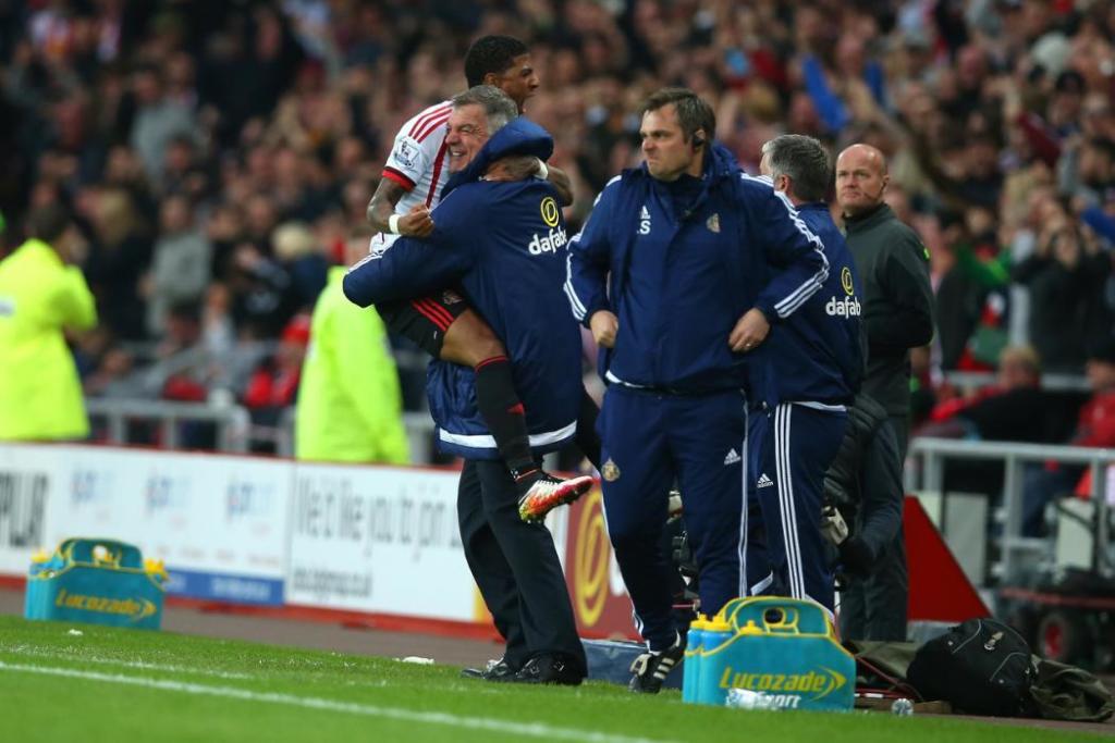 SUNDERLAND, ENGLAND - MAY 11: Patrick van Aanholt of Sunderland celebrates scoring his team's opening goal with manager Sam Allardyce during the Barclays Premier League match between Sunderland and Everton at the Stadium of Light on May 11, 2016 in Sunderland, England. (Photo by Ian MacNicol/Getty Images)
