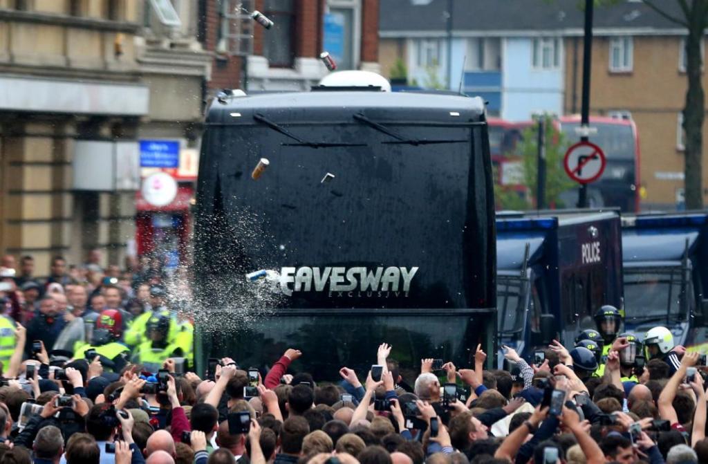 LONDON, ENGLAND - MAY 10: Bottles, beer and missiles are thrown at the Manchester United team bus as it tries to make it's way through the crowds that had congregated in the street prior to the Barclays Premier League match between West Ham United and Manchester United on May 10, 2016 in London, United Kingdom. (Photo by Catherine Ivill - AMA/Getty Images)