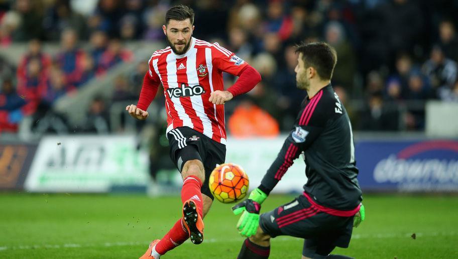 SWANSEA, WALES - FEBRUARY 13: Lukasz Fabianski of Swansea City blocks a shot by Charlie Austin of Southampton during the Barclays Premier League match between Swansea City and Southampton at Liberty Stadium on February 13, 2016 in Swansea, Wales. (Photo by Richard Heathcote/Getty Images)