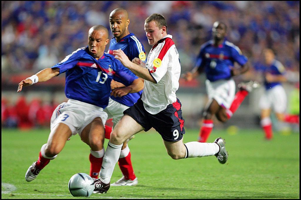 Mikael Silvestre and Wayne Rooney. (Photo by liewig christian/Corbis via Getty Images)