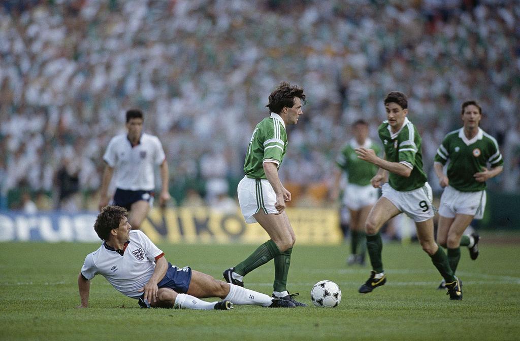 Ray Houghton of the Republic of Ireland moves past England's Kenny Sansom during the European Championship at Stuttgart, 12th June 1988. The score was England 0, Republic of Ireland 1. (Photo by Bob Thomas/Getty Images)