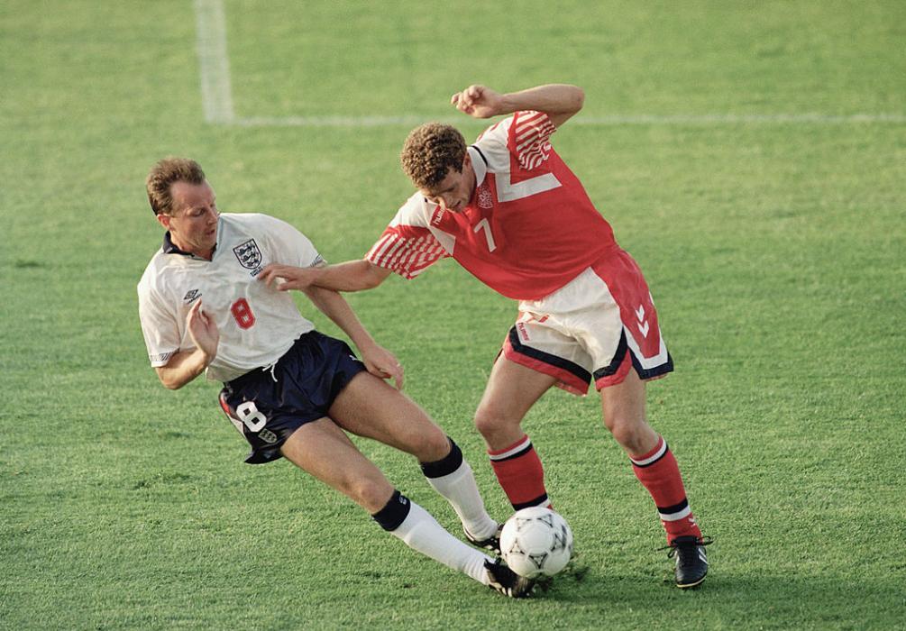 MALMO, SWEDEN - JUNE 11:  John Jensen of Denmark is tackled by Trevor Steven of England during the UEFA European Championships 1992 Group 1 match between Denmark and England held at the Malmo Idrottsplats on June 11, 1992 in Malmo, Sweden. (Photo by Shaun Botterill/Allsport/Getty Images)