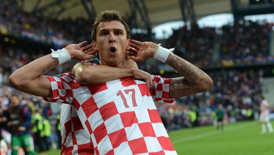 Croatian forward Mario Mandzukic celebrates after scoring a goal during the Euro 2012 championships football match Italy vs Croatia on June 14, 2012 at the Municipal Stadium in Poznan. AFP PHOTO / FRANCISCO LEONG        (Photo credit should read FRANCISCO LEONG/AFP/GettyImages)