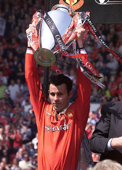 File photo dated 06-05-2000 of Manchester United's Ryan Giggs lifts the FA Carling Premiership trophy.