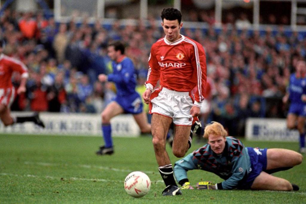 File photo dated 26/12/1991 of Manchester United's Ryan Giggs goes round Oldham Athletic goalkeeper Jon Hallworth (r) to score his team's sixth goal.