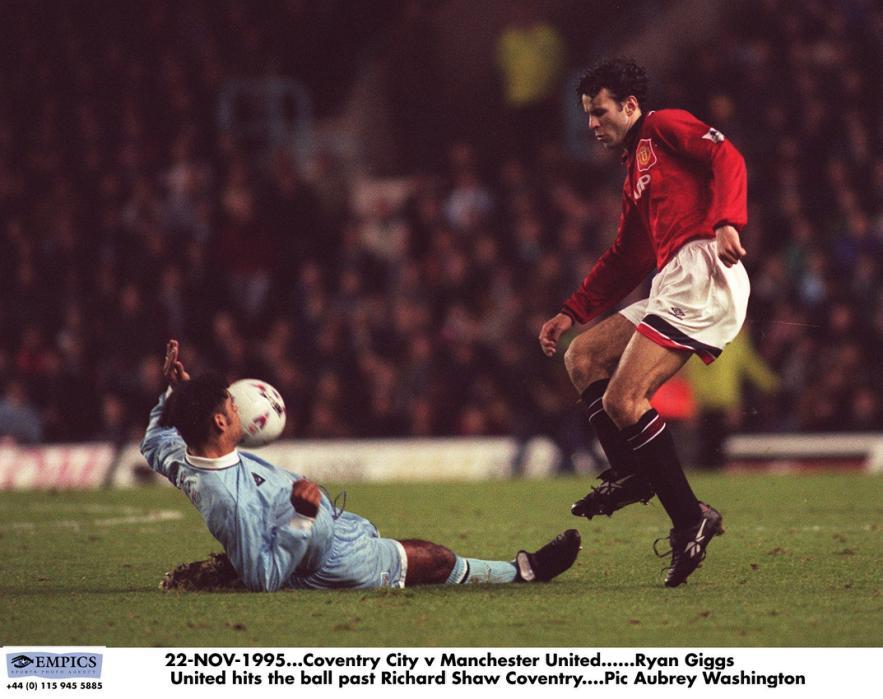 22-NOV-1995. Coventry City v Manchester United. Ryan Giggs United hits the ball past Richard Shaw Coventry