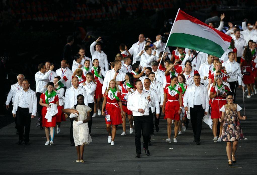 LONDON, ENGLAND - JULY 27:  Peter Biros of the Hungary Olympic water polo team carries his country's flag during the Opening Ceremony of the London 2012 Olympic Games at the Olympic Stadium on July 27, 2012 in London, England.  (Photo by Laurence Griffiths/Getty Images)