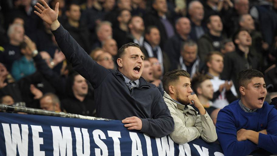 LEVERKUSEN, GERMANY - OCTOBER 18: Fans of Tottenham sing during the UEFA Champions League match between Bayer 04 Leverkusen and Tottenham Hotspur FC at BayArena on October 18, 2016 in Leverkusen, North Rhine-Westphalia.  (Photo by Matthias Hangst/Bongarts/Getty Images)