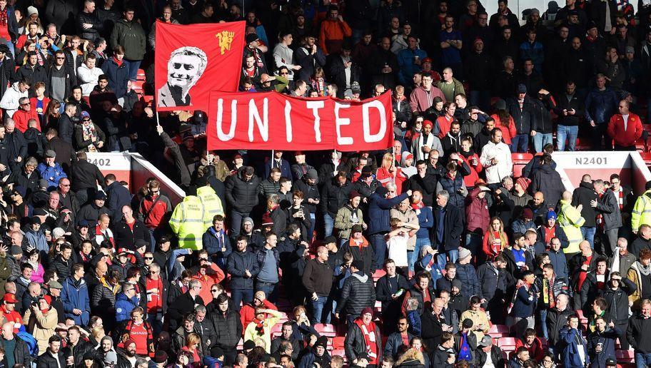 Manchester United fans hold a banner depicting Manchester United's Portuguese manager Jose Mourinho ahead of the English Premier League football match between Manchester United and Arsenal at Old Trafford in Manchester, north west England, on November 19, 2016. / AFP / Paul ELLIS / RESTRICTED TO EDITORIAL USE. No use with unauthorized audio, video, data, fixture lists, club/league logos or 'live' services. Online in-match use limited to 75 images, no video emulation. No use in betting, games or single club/league/player publications.  /         (Photo credit should read PAUL ELLIS/AFP/Getty Images)