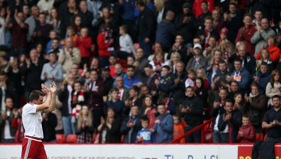 SHEFFIELD, ENGLAND - JULY 26:  Chris Morgan of Sheffield United  applauds the fans after making his final appearance in club colors during the pre season friendly match between Sheffield United and Newcastle United at Bramall Lane on July 26, 2015 in Sheffield, England.  (Photo by Jan Kruger/Getty Images)