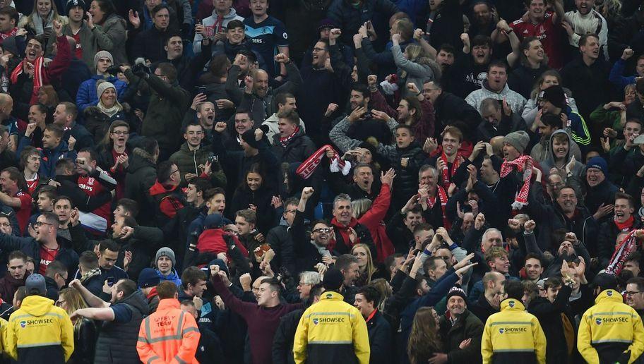 Manchester City's Argentinian defender Pablo Zabaleta (R) reacts as Middlesbrough fans celebrate at the end of the English Premier League football match between Manchester City and Middlesbrough at the Etihad Stadium in Manchester, north west England, on November 5, 2016. / AFP / PAUL ELLIS / RESTRICTED TO EDITORIAL USE. No use with unauthorized audio, video, data, fixture lists, club/league logos or 'live' services. Online in-match use limited to 75 images, no video emulation. No use in betting, games or single club/league/player publications.  /         (Photo credit should read PAUL ELLIS/AFP/Getty Images)