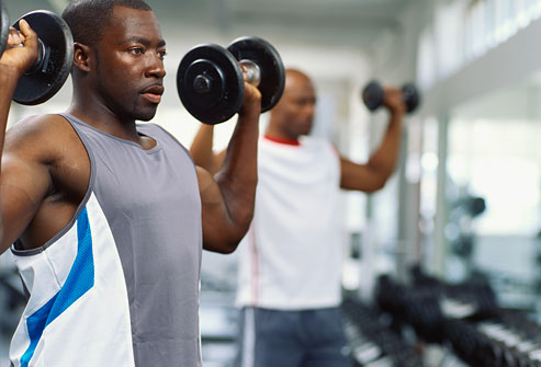 getty_rf_photo_of_men_lifting_weights_in_gym